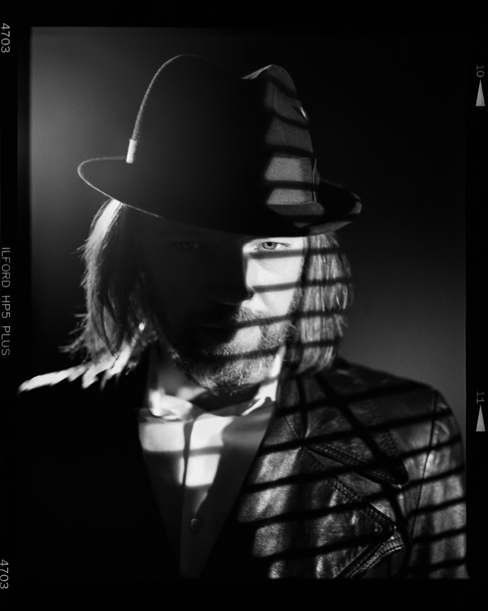 Black and white studio portrait by Henry Lux