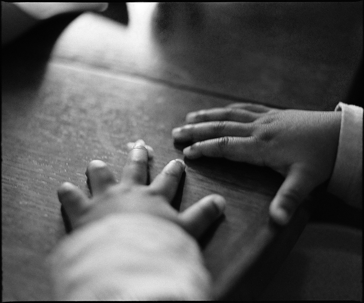 Hands resting on a table