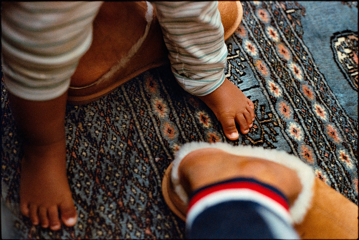 Feet on a rug in a domestic space