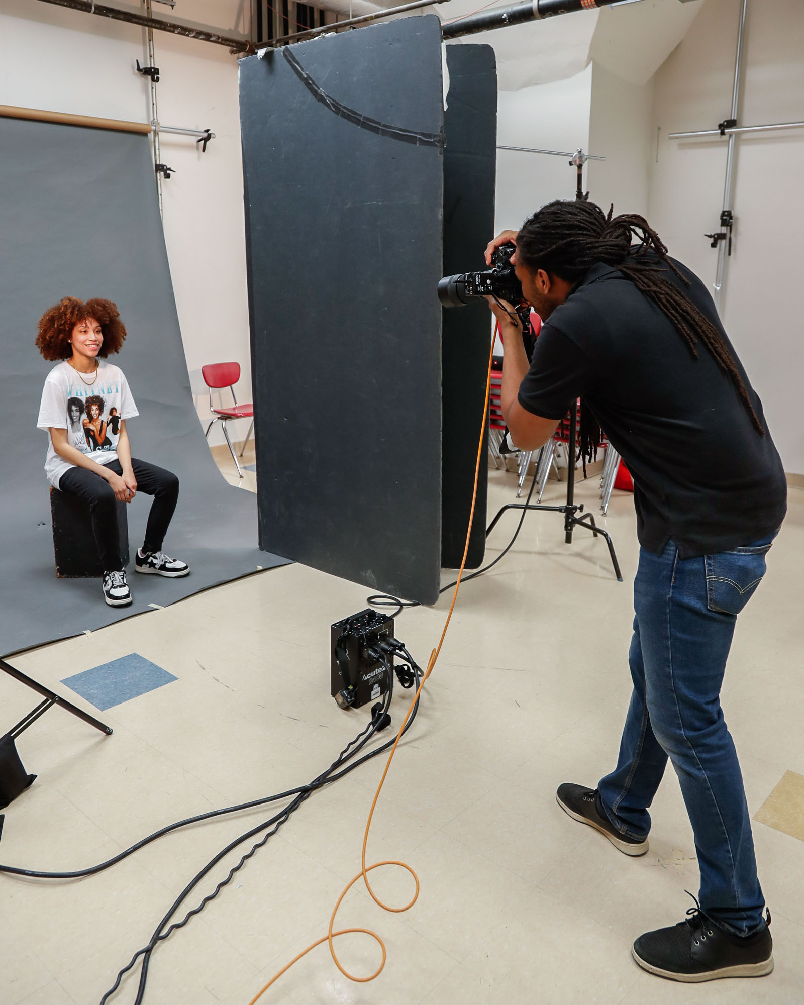 Henry Lux photographing a portrait session in the studio