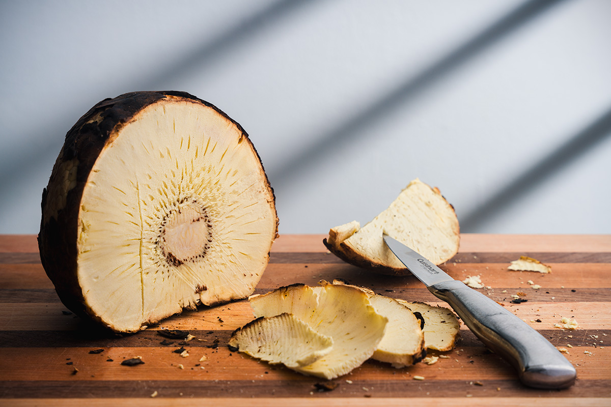 Still life photograph of breadfruit with a knife